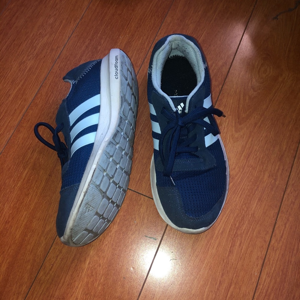 Blue adidas running shoes